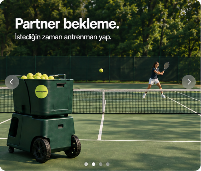 Partner bekleme. İstediğin zaman antrenman yap. Sol ön planda top makinesi, filenin arkasında sağda kadın oyuncu.